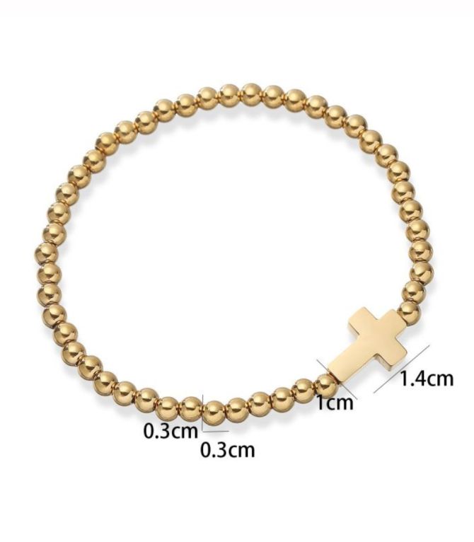 Brazalete dorado con cruz