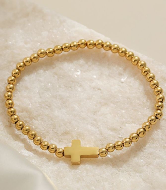 Brazalete dorado con cruz