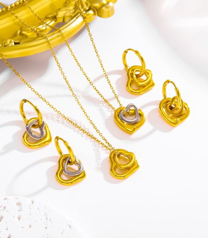 Aretes dorados doble corazón