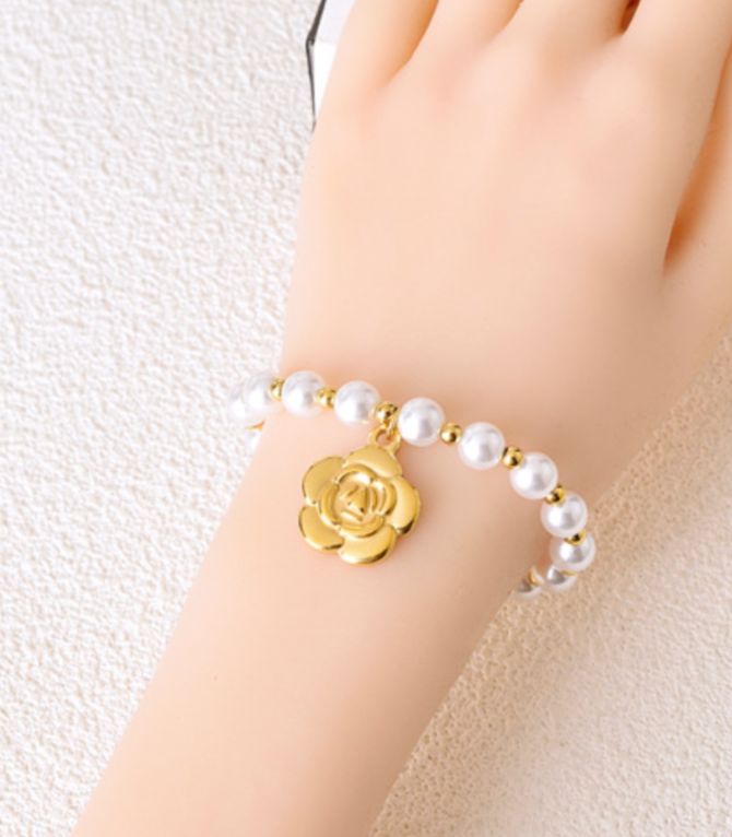 Brazalete perlas y flor